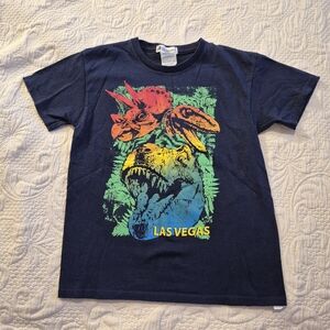 MGM Resorts boys Medium or 8 dinosaur print short sleeve shirt VGUC